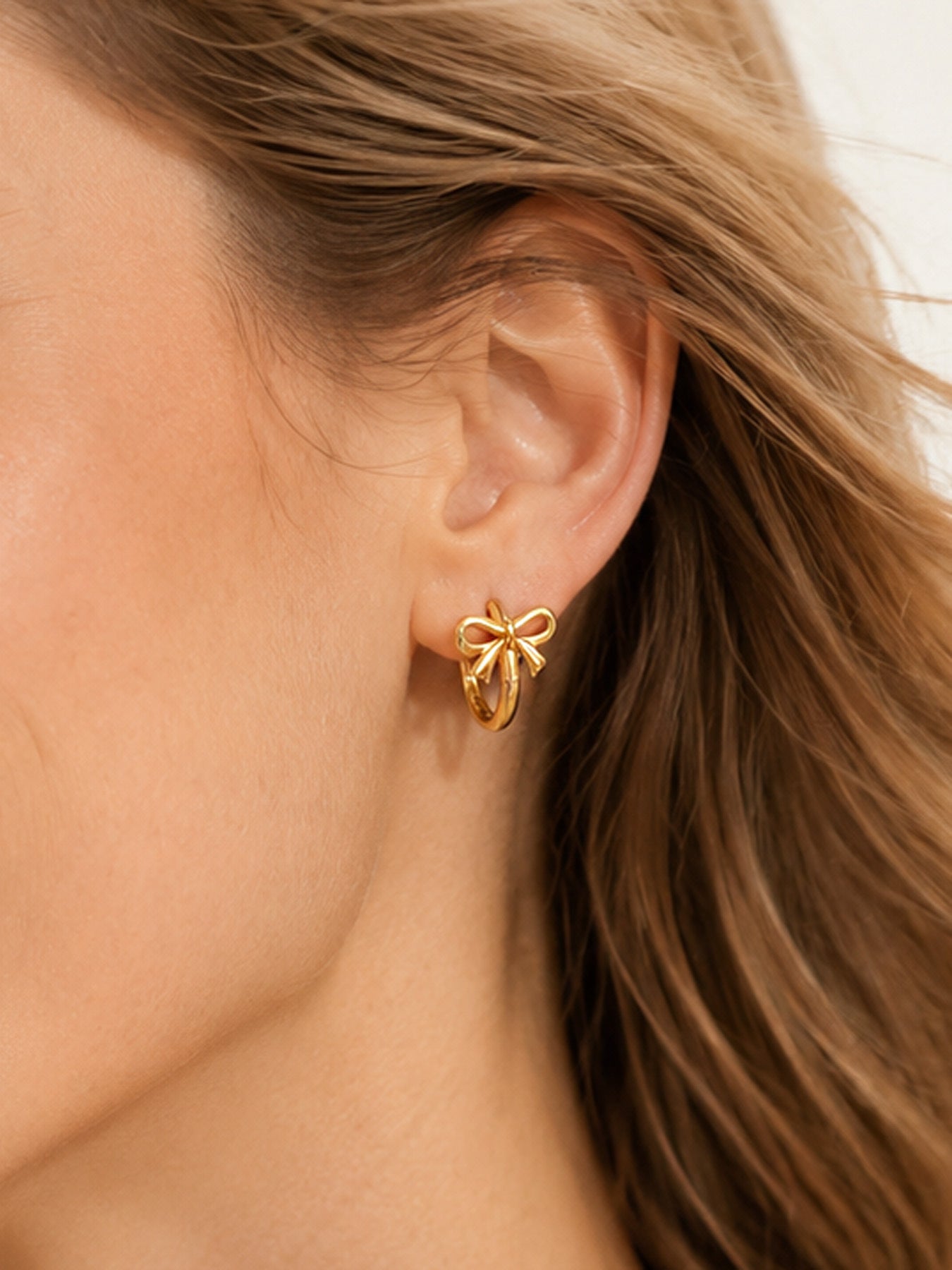 Golden bow hoop earrings