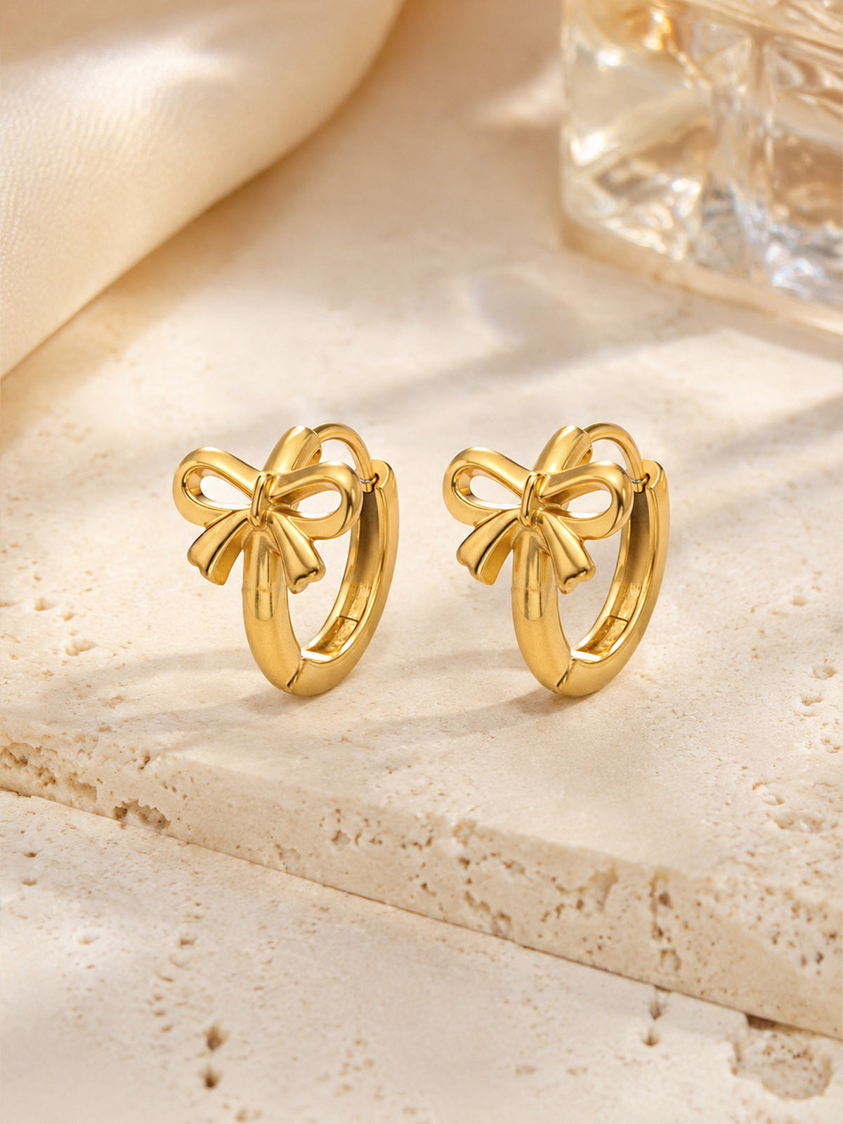Golden bow hoop earrings