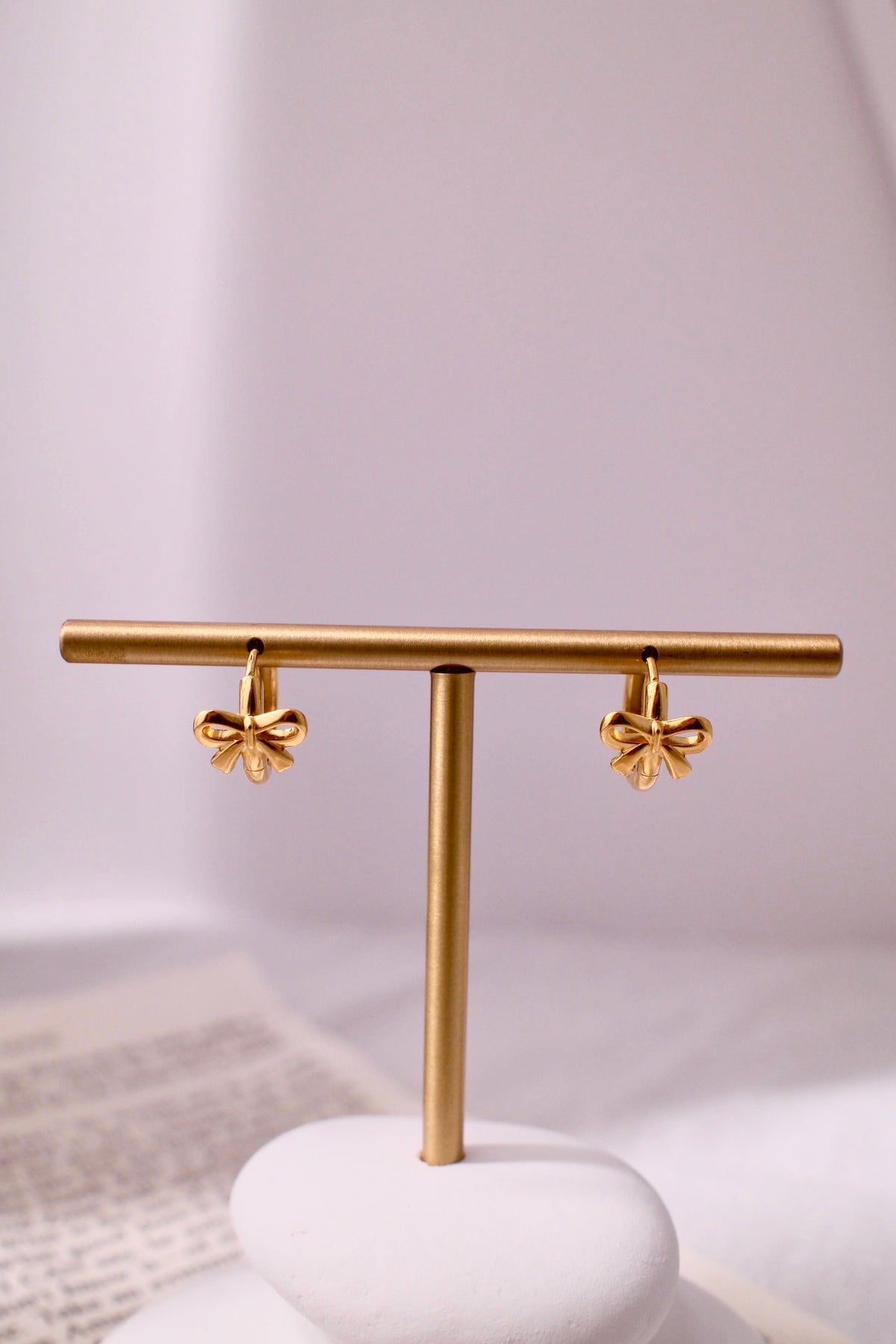 Golden bow hoop earrings