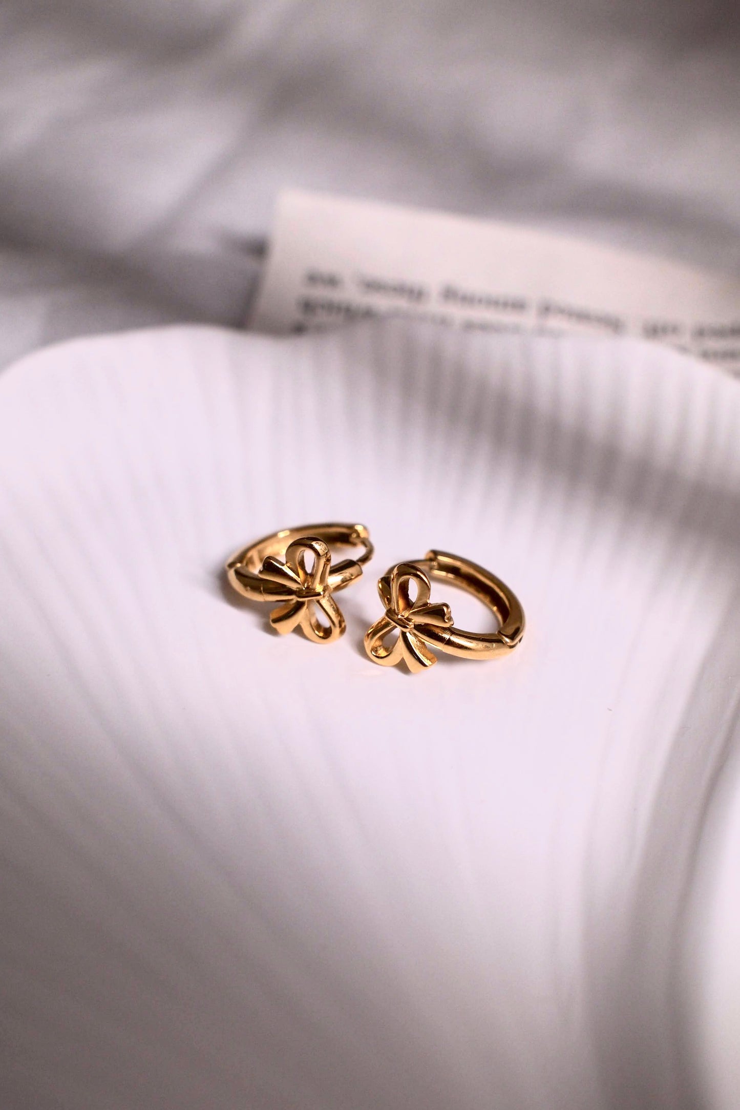 Golden bow hoop earrings